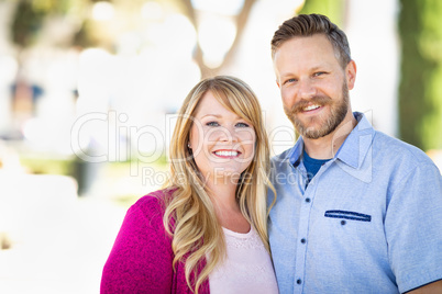 Young Adult Caucasian Couple Portrait At The Park