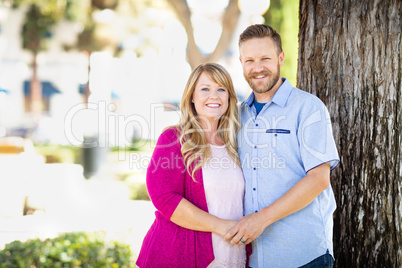 Young Adult Caucasian Couple Portrait At The Park