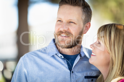 Young Adult Caucasian Couple Portrait At The Park