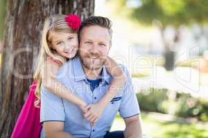 Young Caucasian Father And Daughter Portrait At The Park