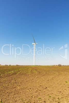 one windmill in a field in spring day, Ukraine