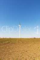 one windmill in a field in spring day, Ukraine