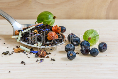 Black tea with different fruits and berries