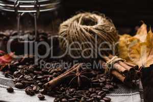 Autumn spices and some kitchenware on towel.