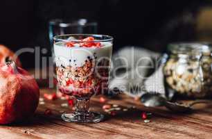 Pomegranate Parfait with Ingredients on Backdrop