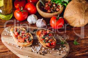 Two Bruschetta with Tomatoes and Ingredients