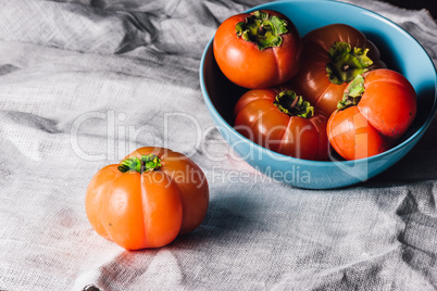 Ripe Persimmons in Bowl