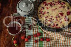 Breakfast with strawberry pie, black tea and berries