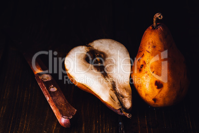 Golden Pear with Half and Knife