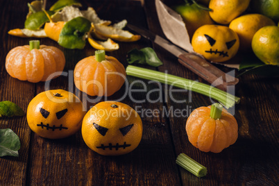 Tngerine Halloween with fake pumpkins
