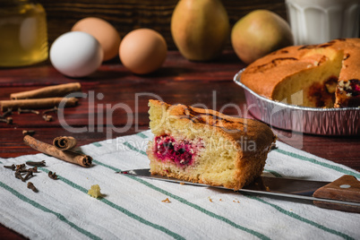 Slice of cherry cake on a striped towel