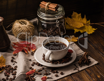 Cup of Coffee with Autumn Leaves