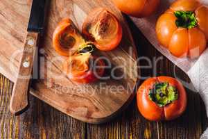 Persimmon Slices on Cutting Board