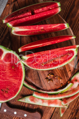Watermelon slices and peels lying on the board