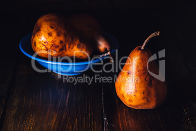 Golden Pears in Blue Bowl