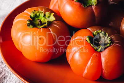 Ripe Persimmons on Plate