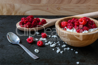 Bowl of cottage cheese with raspberries for breakfast