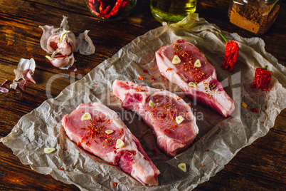 Three Pork Loin Steaks on Parchment