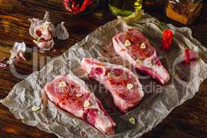 Three Pork Loin Steaks on Parchment