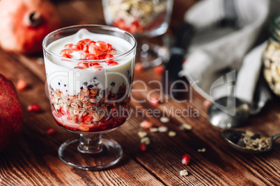 Pomegranate Parfait with Ingredients on Backdrop