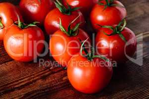 Some Red Tomatoes on Wooden Table