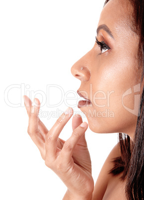Close up image of woman face with her hand on
