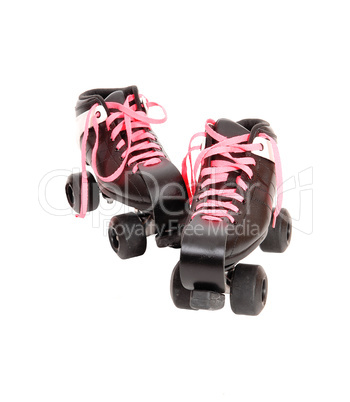 Two roller skates with black boots and pink laces