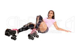 Roller skating woman lying on floor