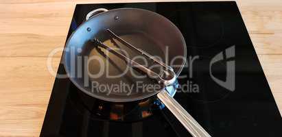 Black ceramic hob with pan