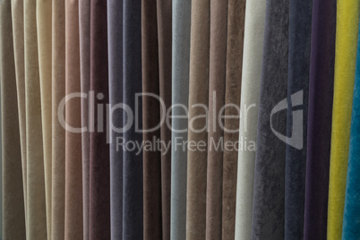 A wide selection of velour and velvet fabrics in the store.