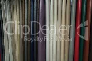A wide selection of leather fabrics in the store.