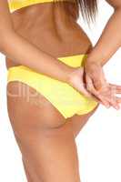 Back of woman in yellow bikini pantie closeup