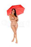Nude woman standing with a red umbrella
