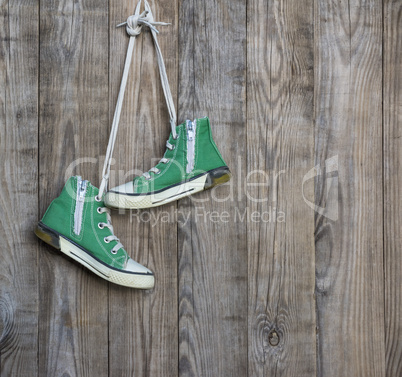 pair of old green textile sneakers