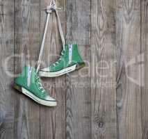 pair of old green textile sneakers