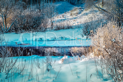 Winter sunny landscape with river and forest