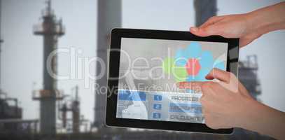 Composite 3d image of hands touching digital tablet against white background
