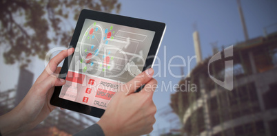 Composite 3d image of cropped image of businesswoman holding digital tablet