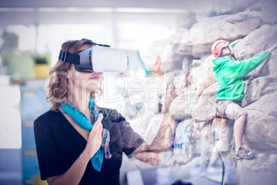 Composite image of female executive wearing virtual reality headset