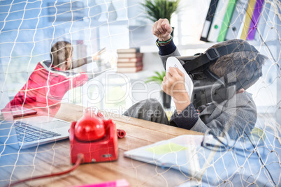 Composite image of boy imitating businessman using virtual reality headset