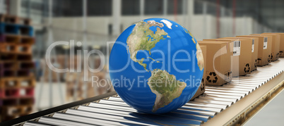 Composite image of boxes and blue globe on conveyor belt