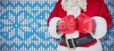 Composite image of mid section of santa with boxing gloves
