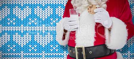 Composite image of santa holding cookie and glass of milk