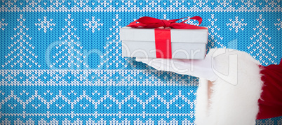 Composite image of santa claus showing gift with red ribbon