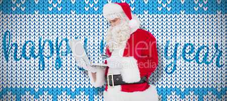 Composite image of santa claus shopping online with laptop