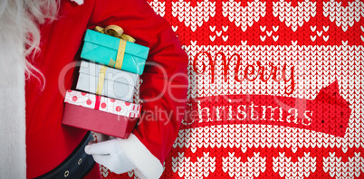 Composite image of santa claus holding gift boxes