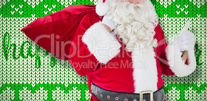 Composite image of santa claus with his sack and thumbs up