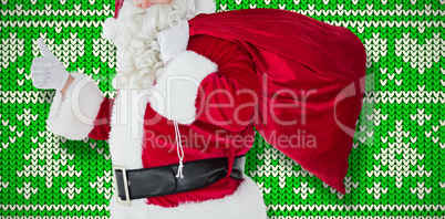 Composite image of positive santa with his sack and thumbs up