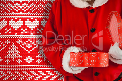 Composite image of santa claus opening a gift box