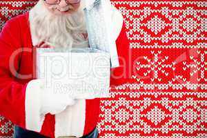 Composite image of santa claus opening a gift box